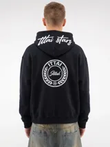 Hoodie negro con capucha, diseño estampado en la espalda con el logo de la marca dentro de un círculo de laureles y texto en la parte posterior de la capucha.