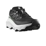 Championes de trail running Salomon Ultra Flow 2, color negro con entresuela blanca y detalles en verde oliva. Presentan un diseño técnico con malla transpirable, refuerzos sintéticos y suela con tacos para mayor tracción en terrenos irregulares.