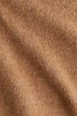 Chaleco corto de punto suave con escote en V, sisas y bajo acanalados.