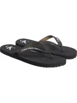 Ojotas negras Calvin Klein Jeans con logo CK en la planta y nombre de la marca en la tira.