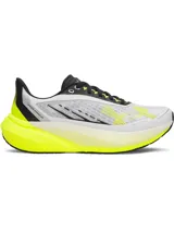 Championes de running Under Armour modelo Velociti Distance, diseñados con tecnología de amortiguación HOVR+ para mayor retorno de energía y estabilidad. Presentan una parte superior de malla técnica ligera y transpirable en color blanco con detalles en amarillo neón y negro.