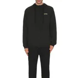 Campera negra Rivvia Pursuit Spray con capucha, cierre frontal completo y logo verde en el pecho.