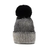 Gorro de lana con diseño de rayas verticales en blanco y negro, con borde doblado y pompón superior de pelo sintético negro.