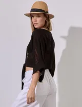 Bolero calado negro de poliéster con mangas 3/4 y frente abierto con lazo.