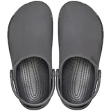 Zuecos Crocs modelo Classic Crafted Clog, de color beige, con parte superior de lona textil y suela de goma Croslite. Incluye correa de talón pivotante y detalles de la marca en el lateral.