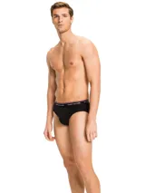 Pack de tres calzoncillos tipo slip de algodón elástico blanco con cintura elástica con logo Tommy Hilfiger.