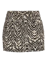 Pollera mini de tiro bajo confeccionada en sarga de algodón con estampado animal print de cebra y corte recto.