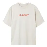 Remera de corte oversize color beige con estampa frontal en estilo pixel art de color naranja.