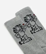 Medias de caña larga color gris melange, confeccionadas en tejido de algodón, con estampado del personaje Garfield en el lateral.