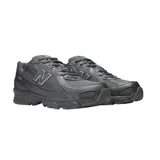 Championes urbanos New Balance modelo 740, color negro con detalles en gris. Presentan una estructura de malla y superposiciones sintéticas, con el logo N característico en los laterales y tecnología de amortiguación ABZORB en la entresuela.