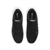 Championes de running Nike modelo Uplift Sc, color negro con detalles en blanco. Presentan un diseño aerodinámico con malla transpirable, logo lateral distintivo y suela con amortiguación.