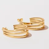 Aros tipo argolla dorados de acero, con triple aro.