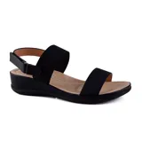 Sandalias bajas negras con dos tiras elásticas anchas y ajuste con hebilla en el tobillo.