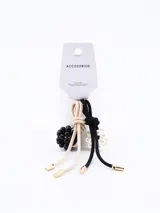 Set de dos coleros para el pelo, uno color beige y otro negro, ambos con adorno de cuentas.