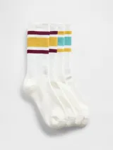 Pack de dos pares de medias de caña media, color blanco con diseño de rayas horizontales en la parte superior. Un par presenta rayas en tonos bordó y amarillo, mientras que el otro par presenta rayas en tonos turquesa y amarillo.