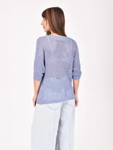 Buzo de punto calado color verde lima, con escote en V y mangas 3/4.