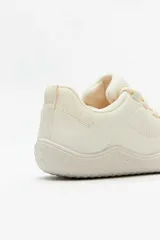 Championes deportivos Paddock Jumps color beige, con diseño de malla y cordones.