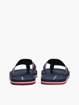 Ojotas Tommy Hilfiger con base azul marino y tiras de poliéster con el logo de la marca en blanco y rojo.