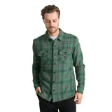 Camisa de manga larga con estampado de cuadros en tonos verdes y negros. Presenta cuello clásico, cierre frontal con botones a presión y dos bolsillos frontales con solapa en el pecho.