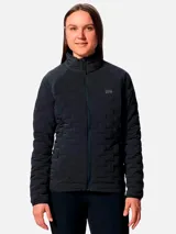 Campera técnica de plumón para mujer, color gris oscuro, con diseño de compartimentos elásticos integrados. Cuenta con cierre frontal completo, cuello alto, bolsillos laterales con cierre y puños con ribete elástico. Es una prenda compresible diseñada para actividades de montaña y senderismo.