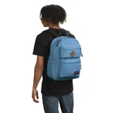 Mochila Jansport color celeste, modelo Double Elemental Blue, con dos compartimentos principales, dos bolsillos frontales con cierre y logo de la marca en la parte inferior.