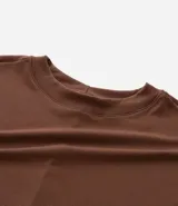 Blusa tipo muscle tee de Ashua, confeccionada en tejido ribana con textura acanalada, cuello redondo y diseño sin mangas.