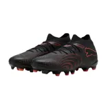 Championes de fútbol Puma Future 9 Match FG/AG, color naranja vibrante con detalles en plateado. Diseño de corte medio con tecnología de ajuste avanzado y suela especializada para tracción en césped natural y artificial.