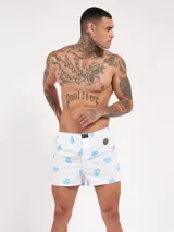Bóxer de algodón blanco con estampado de flores pequeñas color celeste, con cintura elástica y logo de la marca en el centro.