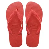 Ojotas Havaianas modelo Top, color gris oscuro con tiras plateadas metálicas con relieve.