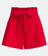 Short femenino de lino estilo clochard color amarillo, con cintura paperbag ajustable mediante un lazo del mismo tejido.