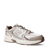 Championes New Balance 530, calzado de estilo retro running en tonos beige, marrón y blanco, con detalles metalizados, capellada de malla transpirable con superposiciones sintéticas, y suela con tecnología ABZORB.