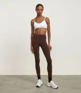 Calza legging deportiva de poliamida color azul con cintura alta de 10 cm.