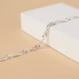 Pulsera de plata 925 con diseño de cadena Singapur de eslabones entrelazados.