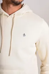 Hoodie de color beige con capucha, cordones ajustables y bolsillo tipo canguro frontal. Presenta el logo de la marca bordado en el pecho.