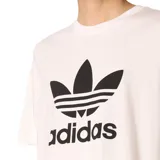 Remera blanca de algodón con logo Adidas Trefoil estampado en negro en el frente.