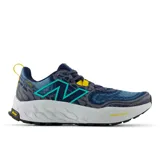 Championes de trail running New Balance Fresh Foam X Hierro v8, color azul con detalles en gris, celeste y amarillo.
