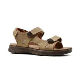 Sandalias de cuero color tostado con ajuste de velcro en el tobillo y en el empeine. Suela marrón con diseño antideslizante.