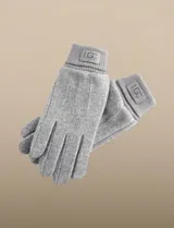 Guantes de tejido soft color negro, con diseño liso y puño elastizado.