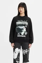 Buzo de cuello redondo en color negro, con estampado gráfico frontal de The Bride of Frankenstein. Presenta un corte holgado y puños acanalados.