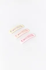 Pack de tres clips para el pelo tipo broche, en tonos pastel: amarillo claro, rosa pálido y rosa más intenso.