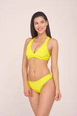 Bombacha vedetina estampada con hojas de palmera en tonos coral, negro, verde y celeste, con terminaciones en amarillo flúor.