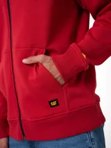 Buzo con capucha y cierre frontal completo, confeccionado en tejido fleece color rojo. Presenta bolsillos tipo canguro, puños y bajo acanalados, y etiqueta con logo de la marca en el bajo izquierdo.