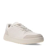 Championes urbanos de diseño minimalista en color beige, con paneles de gamuza en la puntera y el talón, cierre de cordones y suela de goma al tono.
