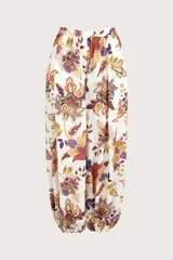 Pantalón tipo aladín con cintura elástica y puños ajustados en los tobillos. Presenta un estampado botánico multicolor sobre fondo blanco.