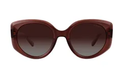 Lentes de sol Azzaro con armazón de acetato en color marrón translúcido y diseño de forma redondeada. Cuentan con cristales polarizados en degradé.