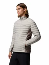 Campera puffer híbrida Columbia modelo Powder Pass Hybrid, de color gris claro con paneles laterales en tono marrón oscuro. Cuenta con cuello alto, cierre frontal completo y bolsillos laterales con cierre. Logo de la marca bordado en el pecho.