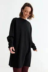 Vestido de algodón de corte holgado y diseño minimalista, con cuello redondo y mangas largas con puños acanalados.