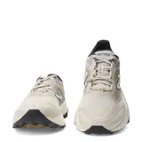 Championes New Balance Tektrel para mujer, en color beige con detalles en mostaza y negro, diseñados para trail running y actividades al aire libre.