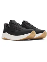 Championes de entrenamiento Under Armour modelo W Aurora 3, diseñados específicamente para el pie femenino. Presentan una parte superior de malla transpirable en color negro con detalles en gamuza, mediasuela blanca con amortiguación Charged+ y suela de goma color caramelo con patrón de tracción multidireccional.