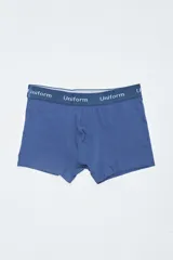 Boxer azul con elástico en la cintura con la palabra "Uniform" repetida.